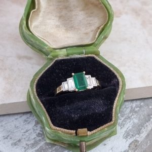 Five stone emerald and diamond engagement ring set in 18ct yellow gold
