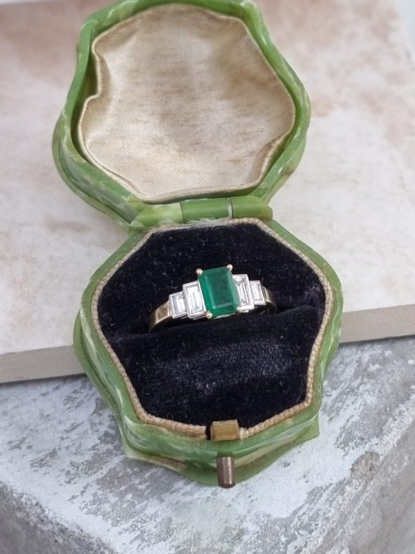 Five stone emerald and diamond engagement ring set in 18ct yellow gold