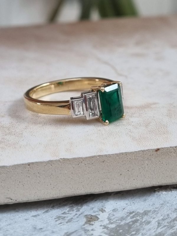 Five stone emerald and diamond engagement ring set in 18ct yellow gold