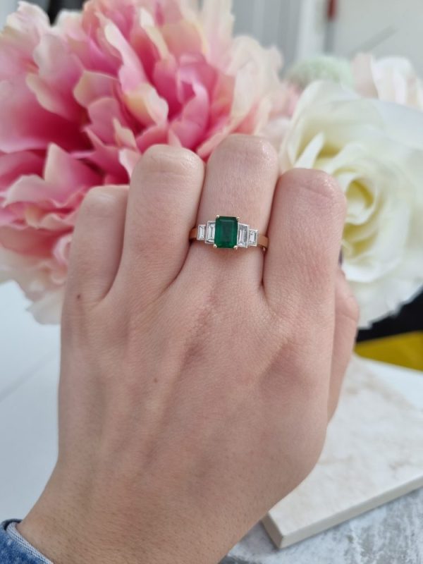 Five stone emerald and diamond engagement ring set in 18ct yellow gold