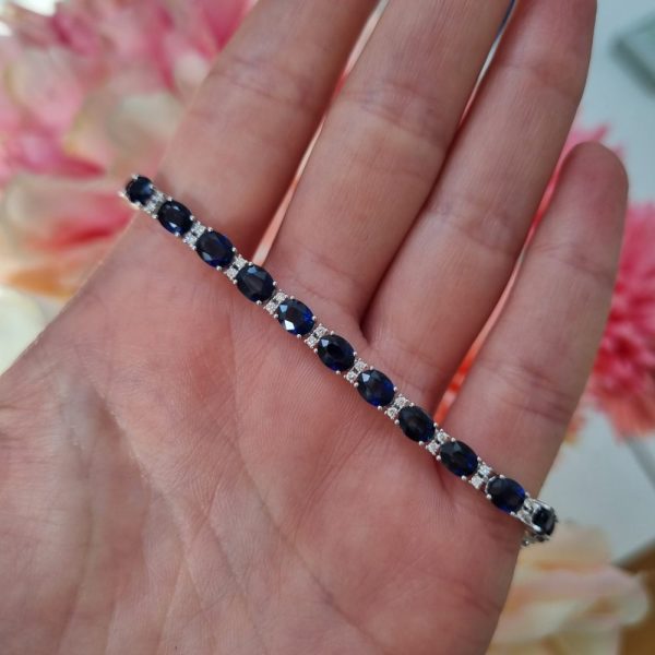 Sapphire and diamond bracelet with 27 sapphires and 55 diamonds, claw set in 18ct white gold.