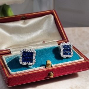 Elegant sapphire and diamond cluster earrings with 1.62ct princess-cut sapphires and 0.44ct diamonds, set in 18ct white gold