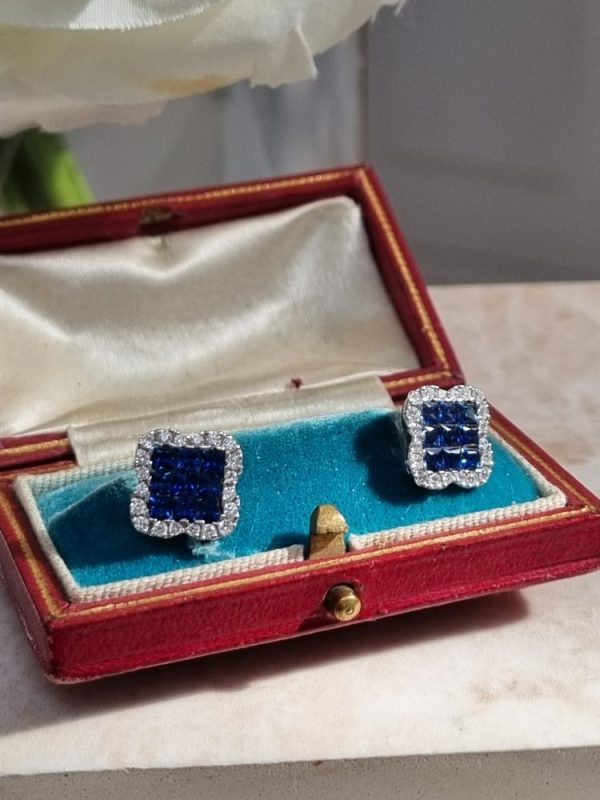 Elegant sapphire and diamond cluster earrings with 1.62ct princess-cut sapphires and 0.44ct diamonds, set in 18ct white gold