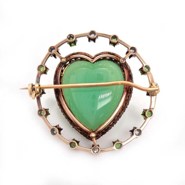 Antique Chalcedony Heart Brooch with Demantoid Garnet and Diamond, heart shaped cabochon chalcedony surrounded by fixed halo of alternating diamonds and demantoid garnets in 15ct yellow gold