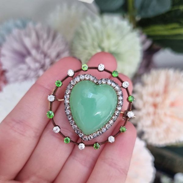 Antique Chalcedony Heart Brooch with Demantoid Garnet and Diamond, heart shaped cabochon chalcedony surrounded by fixed halo of alternating diamonds and demantoid garnets in 15ct yellow gold