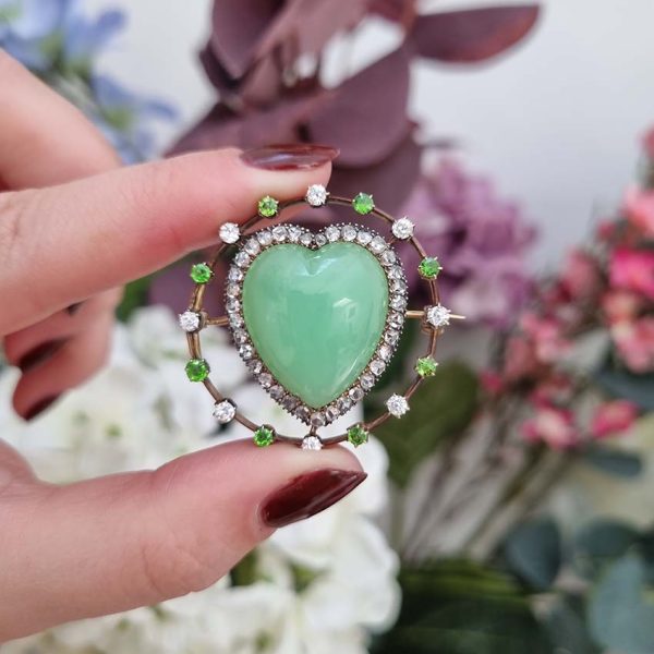 Antique Chalcedony Heart Brooch with Demantoid Garnet and Diamond, heart shaped cabochon chalcedony surrounded by fixed halo of alternating diamonds and demantoid garnets in 15ct yellow gold