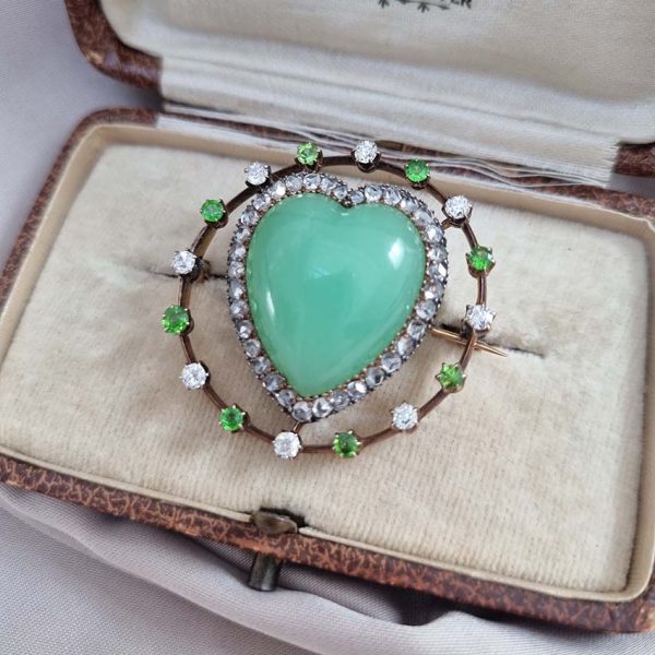 Antique Chalcedony Heart Brooch with Demantoid Garnet and Diamond, heart shaped cabochon chalcedony surrounded by fixed halo of alternating diamonds and demantoid garnets in 15ct yellow gold