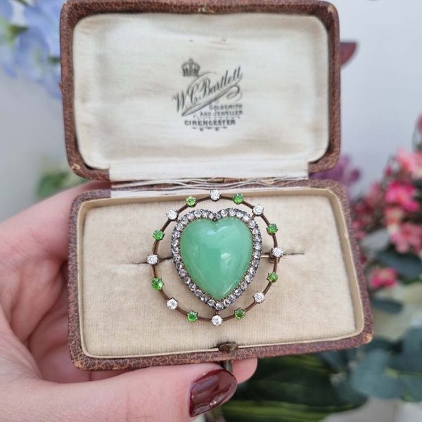 Antique Chalcedony Heart Brooch with Demantoid Garnet and Diamond, heart shaped cabochon chalcedony surrounded by fixed halo of alternating diamonds and demantoid garnets in 15ct yellow gold