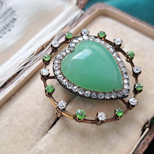 Antique Chalcedony Heart Brooch with Demantoid Garnet and Diamond, heart shaped cabochon chalcedony surrounded by fixed halo of alternating diamonds and demantoid garnets in 15ct yellow gold