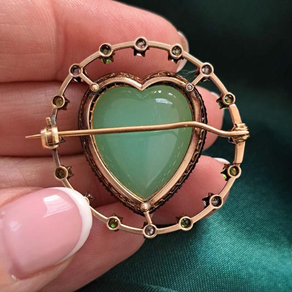 Antique Chalcedony Heart Brooch with Demantoid Garnet and Diamond, heart shaped cabochon chalcedony surrounded by fixed halo of alternating diamonds and demantoid garnets in 15ct yellow gold