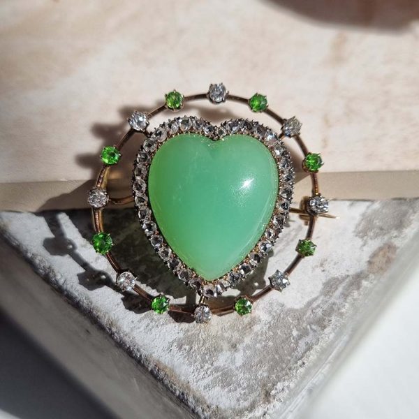 Antique Chalcedony Heart Brooch with Demantoid Garnet and Diamond, heart shaped cabochon chalcedony surrounded by fixed halo of alternating diamonds and demantoid garnets in 15ct yellow gold