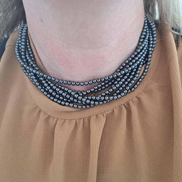 Pre Owned Tiffany and Co Hematite Bead Necklace, eight strands of rich hematite beads leading to a twisted silver hoop and T-bar clasp in Tiffany & Co pouch