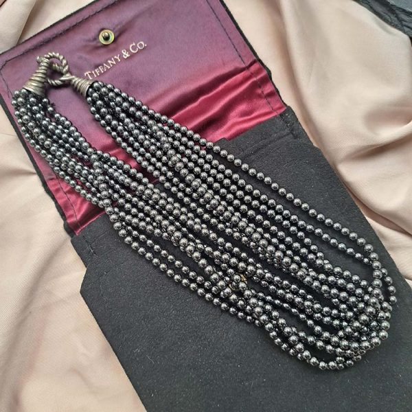 Pre Owned Tiffany and Co Hematite Bead Necklace, eight strands of rich hematite beads leading to a twisted silver hoop and T-bar clasp in Tiffany & Co pouch