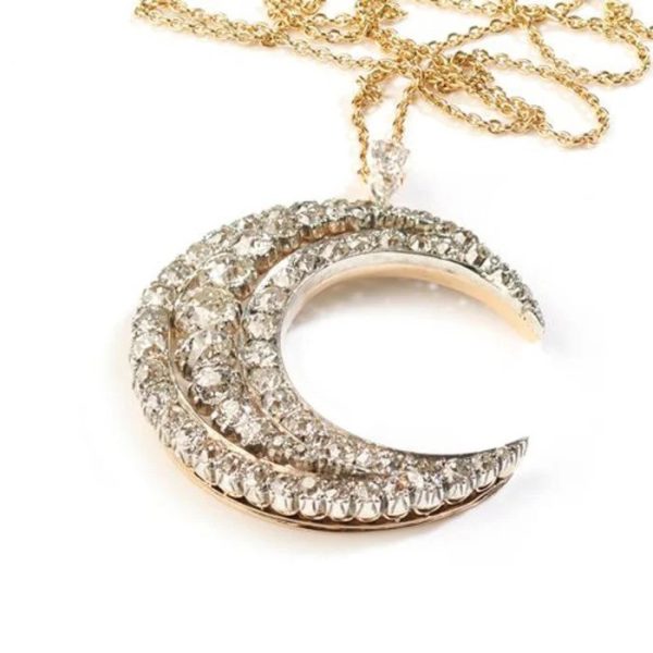 Victorian Antique Old Cut Diamond Crescent Moon Pendant, set with graduating rows of old-cut diamonds in silver-upon-gold, Circa 1890
