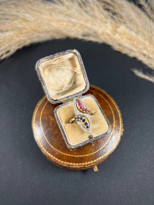 Vintage Ruby Sapphire Diamond Double Head Snake Navette Cluster Ring, marquise shaped diamond cluster ring with ruby and sapphire snake heads in 14ct gold. Circa 1950s