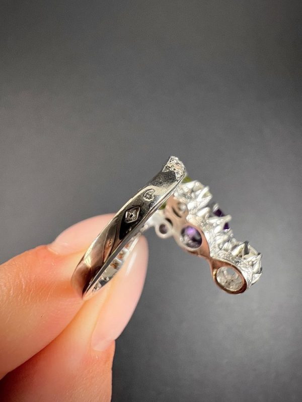 Edwardian Antique French Suffragette Amethyst Peridot Diamond Three Stone Ring, graduating trilogy of peridot amethyst and diamond arranged vertically up the finger when worn in 18ct white gold on diamond-set band with French eagles head stamp