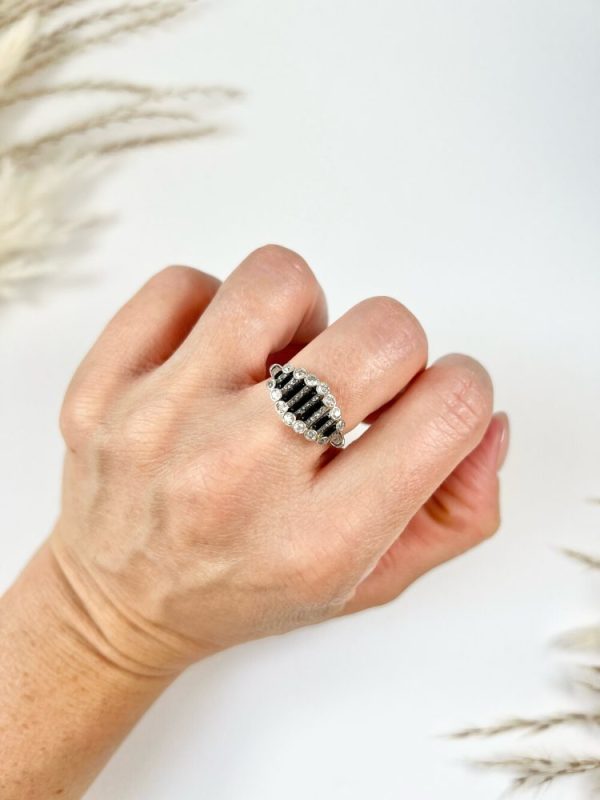 Art Deco Old Cut Diamond and Onyx Ring in Platinum, alternating bands of old-cut diamonds and black onyx with a decorative reeded band. Circa 1920s