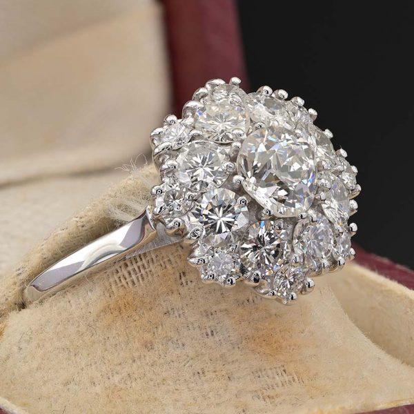 Vintage 2.95ct Diamond Cluster Engagement Ring, 0.95ct old European-cut diamond surrounded by 2cts round brilliant-cut diamonds in floral and petal design in 18ct white gold. Circa 1950s