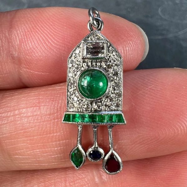Art Deco Emerald and Diamond Pendant with Ruby Sapphire, platinum charm pendant designed as a diamond and emerald cuckoo clock with sapphire, ruby and emerald weights and pendulum