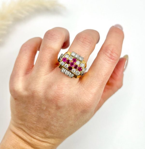 Late Art Deco French Ruby and Diamond Cross Tank Cocktail Ring, geometric statement ruby cross surrounded by sparkling diamonds with stepped shoulders in platinum to chunky 18ct yellow gold mount and band. Circa 1930s