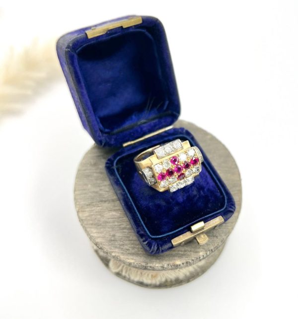 Late Art Deco French Ruby and Diamond Cross Tank Cocktail Ring, geometric statement ruby cross surrounded by sparkling diamonds with stepped shoulders in platinum to chunky 18ct yellow gold mount and band. Circa 1930s