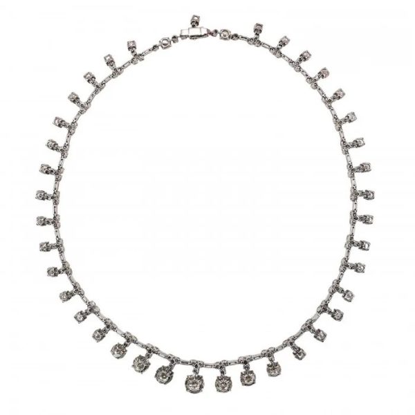 Vintage French Diamond Riviere Necklace in Platinum, 37.84 carats, graduating brilliant diamond drops on articulating chain of alternating pairs of round brilliant-cut diamonds, with baguette-cut diamonds. Circa 1950s