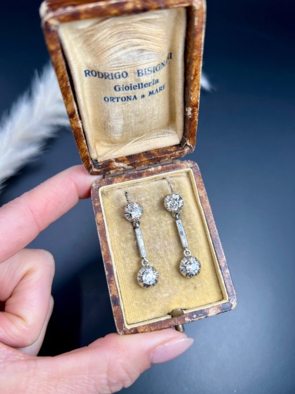 Antique Art Deco 1.6ct Old Cut Diamond Dormeuse Drop Earrings, elegant long baguette-cut diamond stems with old European-cut diamonds top and bottom in platinum to 18ct yellow gold