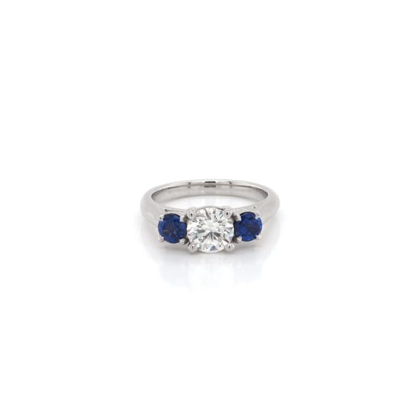 Diamond and sapphire three stone ring in platinum.