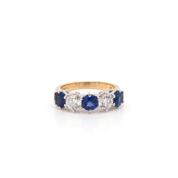 Sapphire and diamond five stone ring in yellow gold.