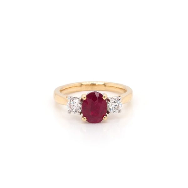 Ruby and diamond three stone ring in gold.