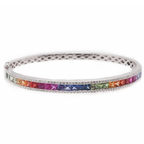 Rainbow sapphire and diamond bangle in white gold.