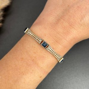 Edwardian Antique Sapphire and Seed Pearl Link Bracelet, long rectangular links with delicate row of natural seed pearls interspersed with square-cut sapphires in platinum and 18ct yellow gold.. Circa 1910