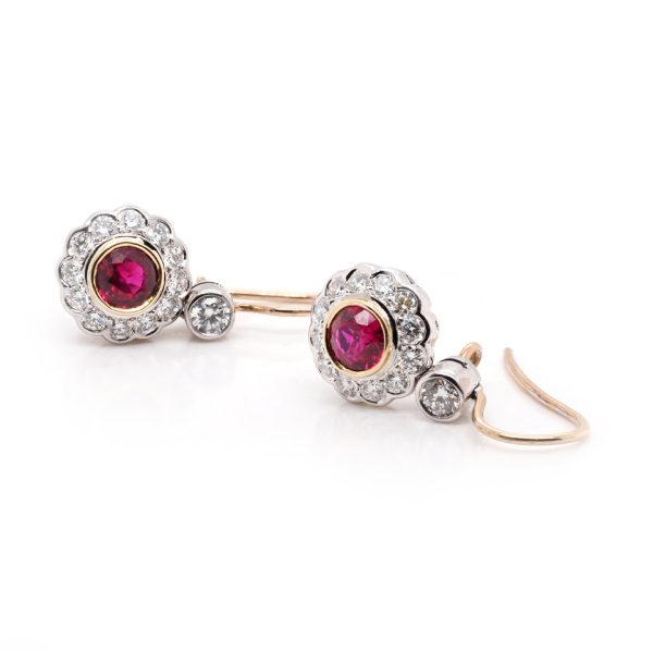 Ruby and diamond drop earrings in gold.
