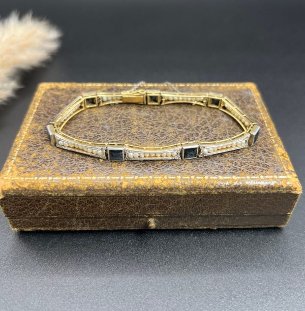 Edwardian Antique Sapphire and Seed Pearl Link Bracelet, long rectangular links with delicate row of natural seed pearls interspersed with square-cut sapphires in platinum and 18ct yellow gold.. Circa 1910