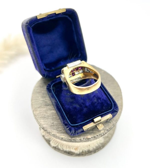Late Art Deco French Ruby and Diamond Cross Tank Cocktail Ring, geometric statement ruby cross surrounded by sparkling diamonds with stepped shoulders in platinum to chunky 18ct yellow gold mount and band. Circa 1930s