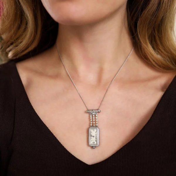 Tiffany and Co Art Deco 2.10ct Diamond Natural Pearl and Platinum Watch Pendant, Circa 1925. Movement signed C H Meylan