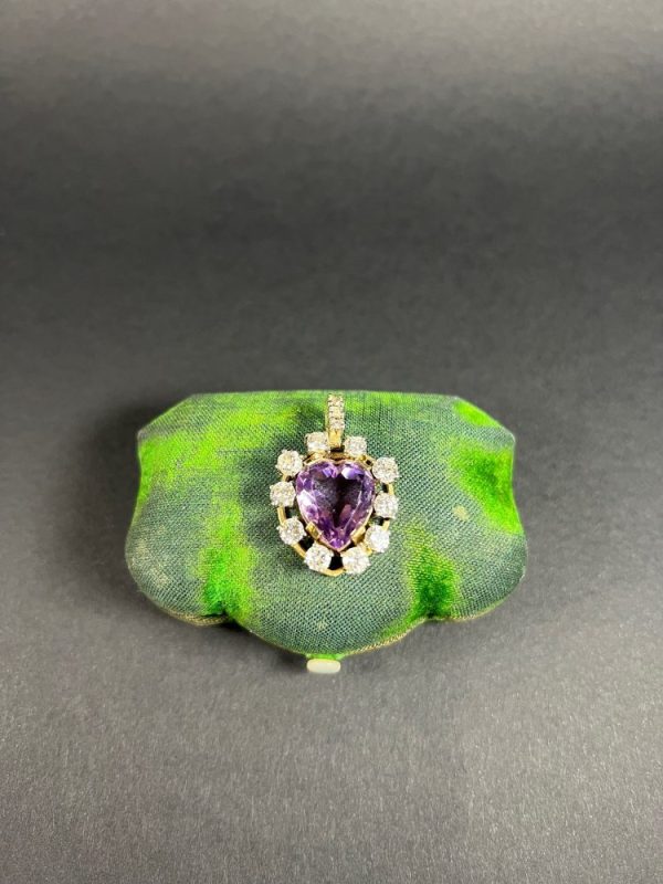 Antique Art Deco Heart Amethyst and Diamond Cluster Pendant, heart-shaped amethyst surrounded by halo of diamonds with diamond bail in 14ct yellow gold. Circa 1920s