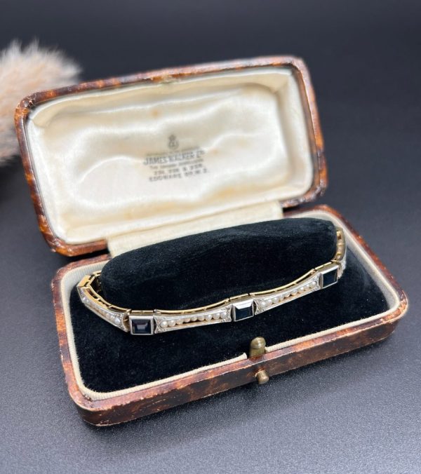 Edwardian Antique Sapphire and Seed Pearl Link Bracelet, long rectangular links with delicate row of natural seed pearls interspersed with square-cut sapphires in platinum and 18ct yellow gold.. Circa 1910