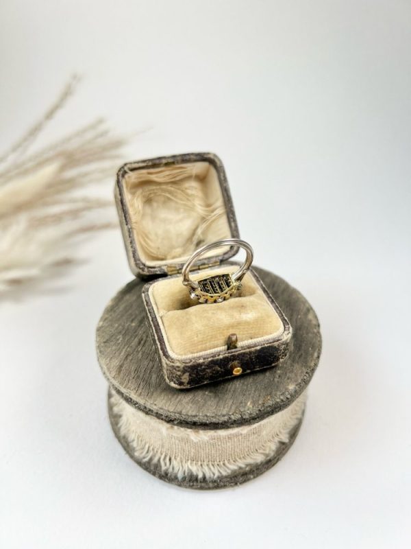 Art Deco Old Cut Diamond and Onyx Ring in Platinum, alternating bands of old-cut diamonds and black onyx with a decorative reeded band. Circa 1920s