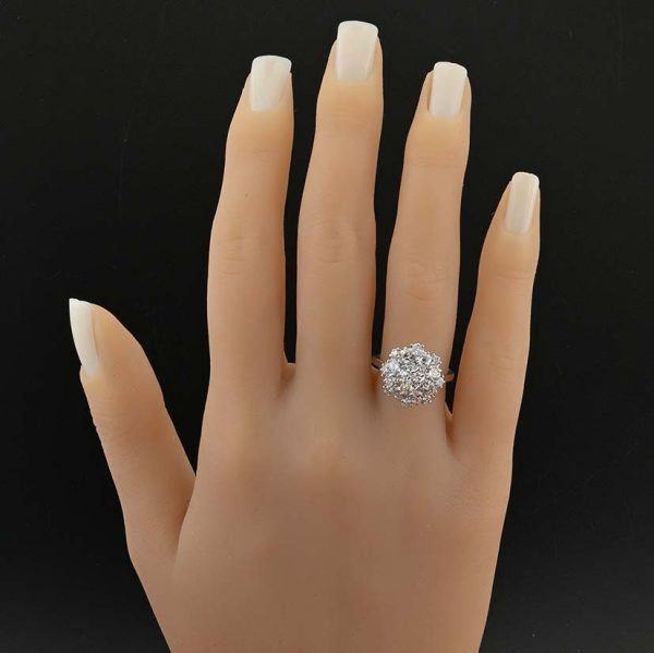 Vintage 2.95ct Diamond Cluster Engagement Ring, 0.95ct old European-cut diamond surrounded by 2cts round brilliant-cut diamonds in floral and petal design in 18ct white gold. Circa 1950s