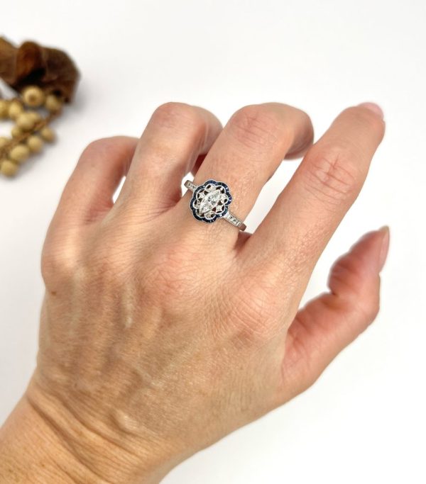 Art Deco Inspired Marquise Diamond and Sapphire Cluster Dress Ring in Platinum, marquise-cut diamond within diamond set intricate open-work design surround and outer border of calibre sapphires. Circa 2000