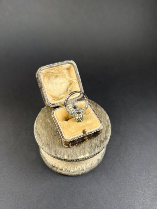 Edwardian Antique French Suffragette Amethyst Peridot Diamond Three Stone Ring, graduating trilogy of peridot amethyst and diamond arranged vertically up the finger when worn in 18ct white gold on diamond-set band with French eagles head stamp