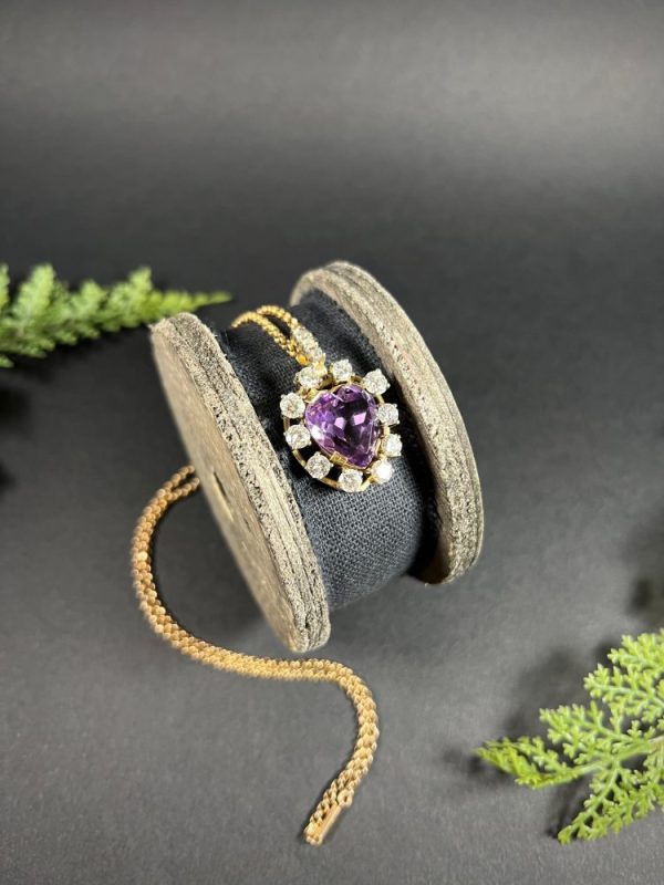 Antique Art Deco Heart Amethyst and Diamond Cluster Pendant, heart-shaped amethyst surrounded by halo of diamonds with diamond bail in 14ct yellow gold. Circa 1920s