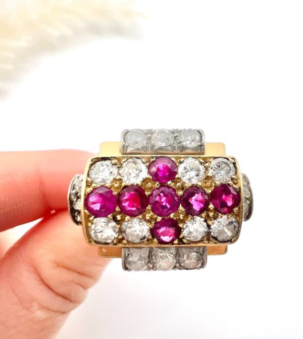 Late Art Deco French Ruby and Diamond Cross Tank Cocktail Ring, geometric statement ruby cross surrounded by sparkling diamonds with stepped shoulders in platinum to chunky 18ct yellow gold mount and band. Circa 1930s