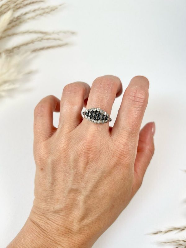 Art Deco Old Cut Diamond and Onyx Ring in Platinum, alternating bands of old-cut diamonds and black onyx with a decorative reeded band. Circa 1920s
