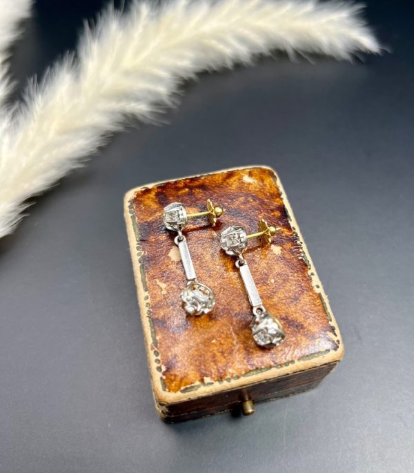 Antique Art Deco 1.6ct Old Cut Diamond Dormeuse Drop Earrings, elegant long baguette-cut diamond stems with old European-cut diamonds top and bottom in platinum to 18ct yellow gold