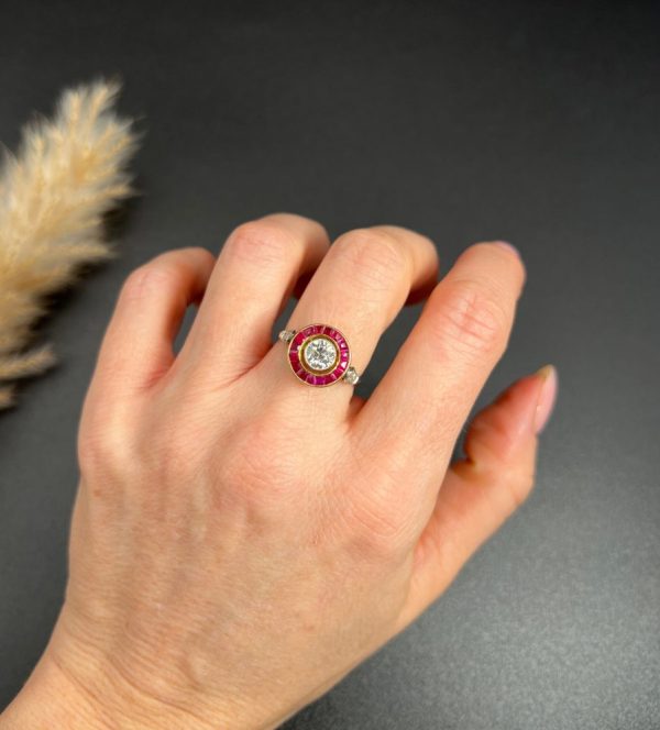 Vintage Antique Art Deco Diamond and Ruby Halo Target Cluster Engagement Ring, 0.65ct diamond framed by border of calibre red rubies in platinum and 18ct yellow gold. Circa 1920s