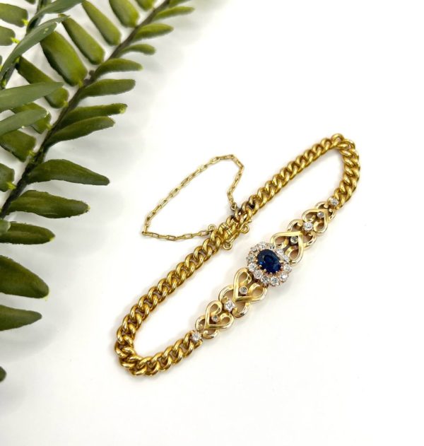 Edwardian Antique Sapphire and Diamond Cluster Fancy Heart Link Gold Curb Bracelet, 18ct yellow gold curb link bracelet with central oval sapphire and diamond cluster flanked by diamond-set heart-shaped links, Circa 1900