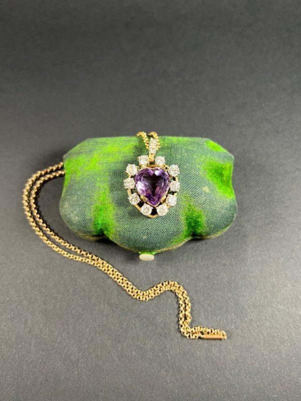 Antique Art Deco Heart Amethyst and Diamond Cluster Pendant, heart-shaped amethyst surrounded by halo of diamonds with diamond bail in 14ct yellow gold. Circa 1920s