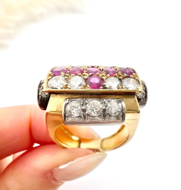 Late Art Deco French Ruby and Diamond Cross Tank Cocktail Ring, geometric statement ruby cross surrounded by sparkling diamonds with stepped shoulders in platinum to chunky 18ct yellow gold mount and band. Circa 1930s